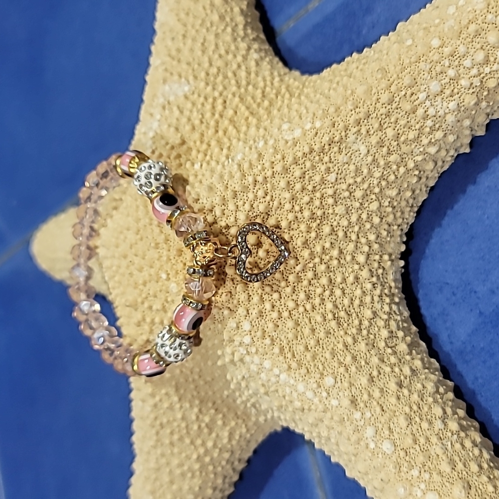 Crystal bracelet with hanging heart charm